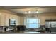 Kitchen with stainless steel appliances, white cabinets, granite countertops, and tile backsplash at 1462 Highfield Dr, Clearwater, FL 33764