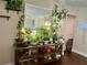 Bright and plant-filled living room with wood floors and warm natural light at 1462 Highfield Dr, Clearwater, FL 33764