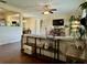 Open concept living room with wood floors, a ceiling fan, and a variety of plants at 1462 Highfield Dr, Clearwater, FL 33764