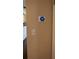 Close-up of a smart thermostat on a wall next to a light switch at 1462 Highfield Dr, Clearwater, FL 33764