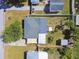This aerial view shows the house, yard and roof. The surrounding neighborhood is also visible at 1529 Essex N Dr, St Petersburg, FL 33710