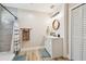 Bathroom features a walk-in shower, a modern vanity, and stylish shiplap accent wall at 1529 Essex N Dr, St Petersburg, FL 33710