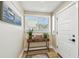 Light and airy entryway with a console table, wood floors, and a front door with sidelight at 1529 Essex N Dr, St Petersburg, FL 33710