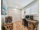 Bright office space with dual monitors, wooden desk, and closet storage at 1529 Essex N Dr, St Petersburg, FL 33710