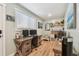 A home office featuring a wooden desk with dual monitors, shelving, and decor at 1529 Essex N Dr, St Petersburg, FL 33710