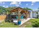 Inviting outdoor patio with pergola, seating, and garden views at 1529 Essex N Dr, St Petersburg, FL 33710