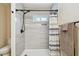 Beautiful bathroom shower featuring updated tile, shower head, and built-in niche at 1529 Essex N Dr, St Petersburg, FL 33710