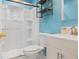 Updated bathroom features a modern vanity, shower and sleek shelving at 1569 Larkin Rd, Spring Hill, FL 34608