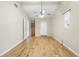 Bright bedroom features a ceiling fan, wood floors and a built-in closet space at 1569 Larkin Rd, Spring Hill, FL 34608
