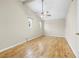 Spacious bedroom with vaulted ceilings, hardwood floors, and ample natural light at 1569 Larkin Rd, Spring Hill, FL 34608