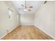 Bright bedroom with vaulted ceilings, hardwood floors, and natural light at 1569 Larkin Rd, Spring Hill, FL 34608