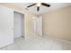 Spacious bedroom featuring tile floors, closet and bright window provides ample space and storage at 1569 Larkin Rd, Spring Hill, FL 34608