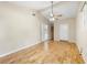 Bedroom boasts natural light, ceiling fan, closet and wood floors at 1569 Larkin Rd, Spring Hill, FL 34608