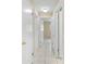 Hallway features tile flooring and several access doors to other rooms at 1569 Larkin Rd, Spring Hill, FL 34608