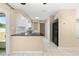 Modern kitchen features white cabinets, black appliances, and ample counter space at 1569 Larkin Rd, Spring Hill, FL 34608
