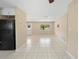 Spacious living room features bright recessed lighting and tile flooring at 1569 Larkin Rd, Spring Hill, FL 34608