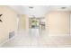 Expansive living room with tile floors, ceiling fan, and neutral colored walls at 1569 Larkin Rd, Spring Hill, FL 34608