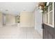 Open living space with tile floors flowing toward the entryway of the home at 1569 Larkin Rd, Spring Hill, FL 34608