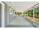 Screened in patio provides an outdoor space for relaxation with a view of the backyard at 1569 Larkin Rd, Spring Hill, FL 34608