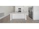 Bright kitchen featuring a central island, stainless steel refrigerator and modern appliances at 1637 Birchcrest Blvd, Port Charlotte, FL 33952