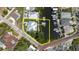 Aerial view displaying the property's boundaries with canal access, featuring a private dock and waterfront at 216 High St, Tarpon Springs, FL 34689
