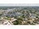 Expansive aerial view of the waterfront community with boat docks and lush green landscape at 216 High St, Tarpon Springs, FL 34689