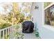 Back porch featuring a covered grill, potted plants, and a light blue exterior with white trim at 216 High St, Tarpon Springs, FL 34689