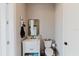 Bright bathroom featuring a modern vanity, decorative mirror, and a neatly arranged toilet at 216 High St, Tarpon Springs, FL 34689