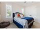 Comfortable bedroom with ample light, a plush bed, and modern decor elements at 216 High St, Tarpon Springs, FL 34689