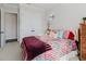 Cozy bedroom with colorful bedding, ceiling fan, and lots of natural lighting at 216 High St, Tarpon Springs, FL 34689
