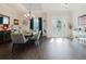 Bright dining room features a chandelier, modern table set, and large windows for natural light at 216 High St, Tarpon Springs, FL 34689
