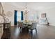Bright dining room features a chandelier, modern table set, and large windows at 216 High St, Tarpon Springs, FL 34689