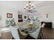 The spacious dining room flows into the living areas and features a glass dining table at 216 High St, Tarpon Springs, FL 34689