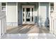 Inviting front entrance featuring a glass door, complemented by charming decor and a welcoming ambiance at 216 High St, Tarpon Springs, FL 34689