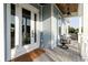Charming front porch with comfortable seating, offering a relaxing outdoor space and stylish decor at 216 High St, Tarpon Springs, FL 34689