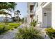Landscaped front yard with stone accents leading to the house, enhancing its curb appeal and coastal charm at 216 High St, Tarpon Springs, FL 34689