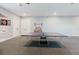 Entertainment room with ping pong table, dart board, and ample space for activities at 216 High St, Tarpon Springs, FL 34689