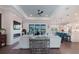 Open-concept living room features a fireplace, tray ceilings, and seamless flow to the kitchen at 216 High St, Tarpon Springs, FL 34689