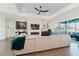 Comfortable living room features an electric fireplace, modern decor, and access to an outdoor patio at 216 High St, Tarpon Springs, FL 34689