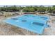Vibrant blue basketball court with clear markings and well-maintained hoops offers an inviting space for sports and recreation at 2216 Eagle Bluff Dr, Valrico, FL 33596