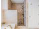 Elegant bathroom featuring a tiled shower with glass door and separate tub at 2216 Eagle Bluff Dr, Valrico, FL 33596