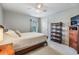 Cozy bedroom with a queen bed, ceiling fan, and plenty of natural light at 2216 Eagle Bluff Dr, Valrico, FL 33596