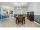 Charming dining room featuring a chandelier, wood table, and easy access to other living areas at 2216 Eagle Bluff Dr, Valrico, FL 33596