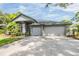 Charming home featuring a two-car garage, well-maintained landscaping, and an inviting curb appeal at 2216 Eagle Bluff Dr, Valrico, FL 33596