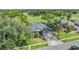 Well-manicured home featuring lush landscaping, a two-car garage, and a serene setting overlooking a golf course at 2216 Eagle Bluff Dr, Valrico, FL 33596
