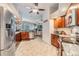Kitchen featuring stainless steel appliances, granite counters and an open floor plan to the living room at 2216 Eagle Bluff Dr, Valrico, FL 33596