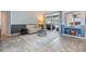 Bright living room featuring tile flooring, a comfortable sofa, and sliding glass doors to the patio at 2216 Eagle Bluff Dr, Valrico, FL 33596