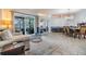 Spacious living space with tile flooring, comfortable seating, and seamless access to the outdoor living area at 2216 Eagle Bluff Dr, Valrico, FL 33596