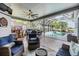 Outdoor patio with covered dining and seating area, and screened-in pool at 2216 Eagle Bluff Dr, Valrico, FL 33596