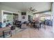 Spacious covered patio with outdoor seating, dining area, and a screened-in pool at 2216 Eagle Bluff Dr, Valrico, FL 33596